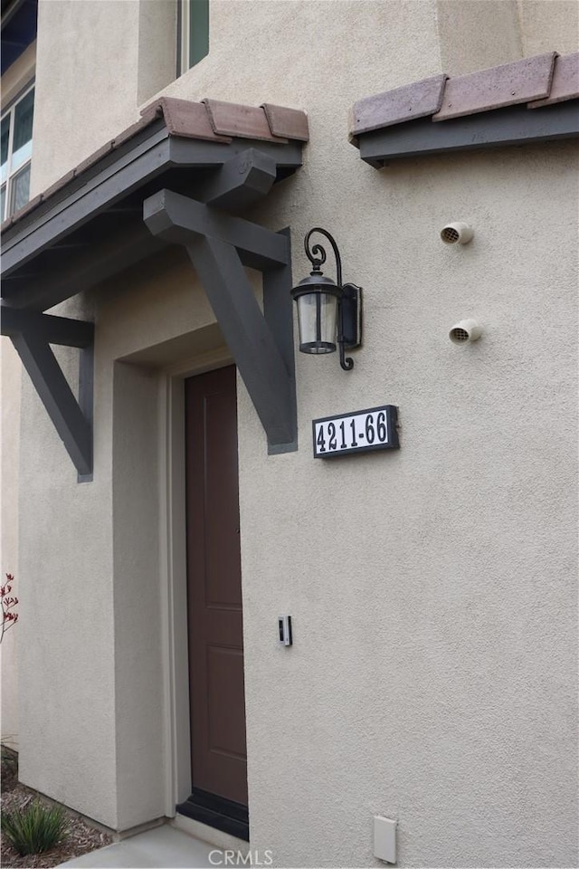 4211 E Malagon Privado Unit 66, Ontario, CA 91761 - property entrance featuring stucco siding