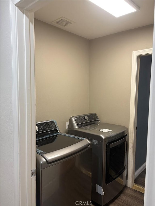 7548 Chase Ave, Hesperia, CA 92345 - clothes washing area with washing machine and clothes dryer and dark wood-style flooring