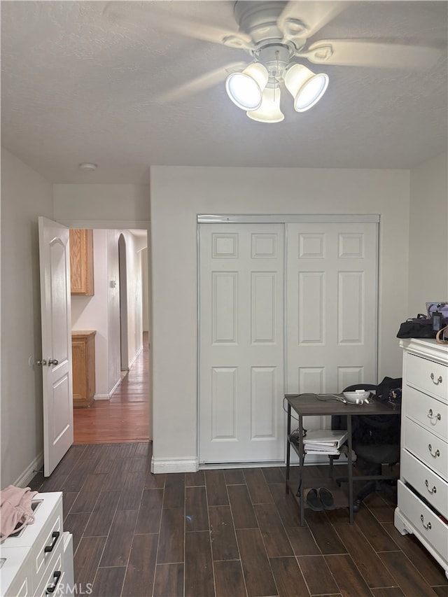 7548 Chase Ave, Hesperia, CA 92345 - home office with dark wood-type flooring, baseboards, and ceiling fan