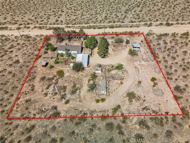 bird's eye view featuring a desert view and a rural view