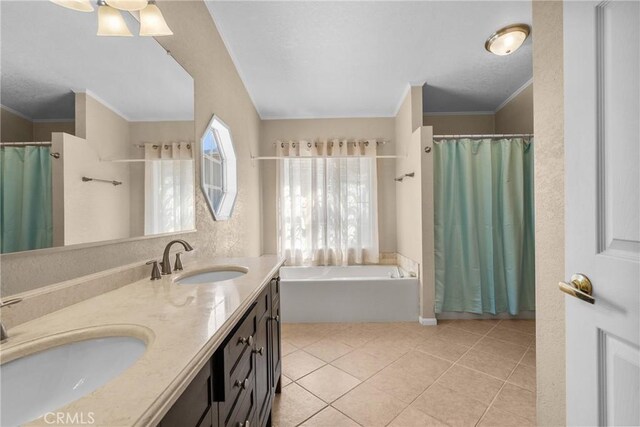 bathroom featuring a garden tub, a sink, tile patterned floors, and ornamental molding