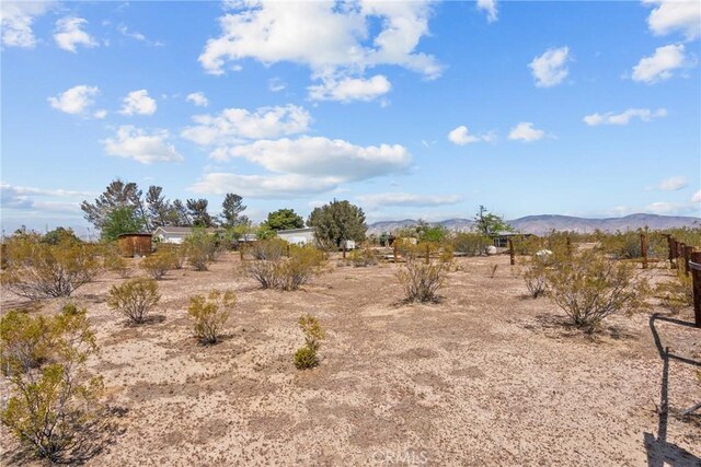 view of local wilderness featuring a mountain view and a rural view
