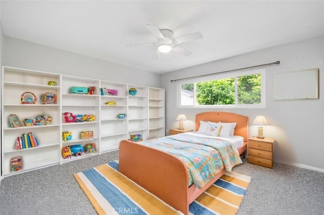 carpeted bedroom with baseboards and a ceiling fan