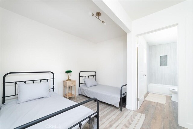 bedroom featuring light wood-type flooring
