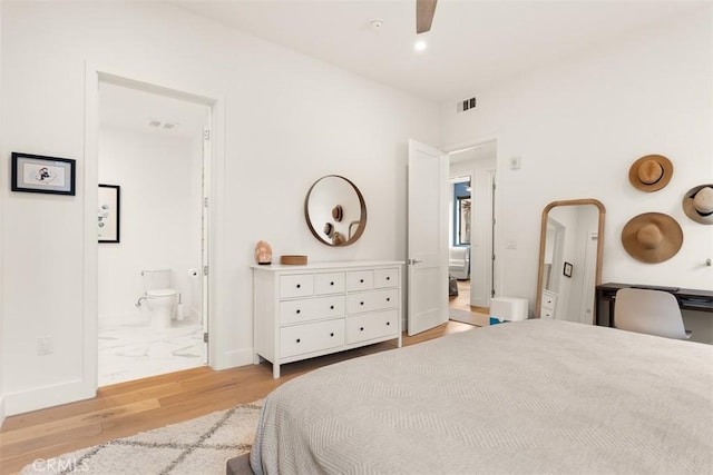 4322 Gentry Ave Unit 104, Studio City, CA 91604 - bedroom featuring visible vents, light wood finished floors, ensuite bathroom, and baseboards