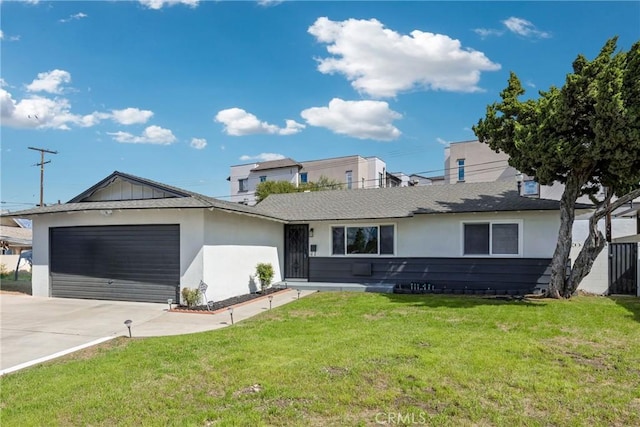 4832 Olive St, Montclair, CA 91763 - ranch-style home featuring a garage, stucco siding, concrete driveway, and a front yard