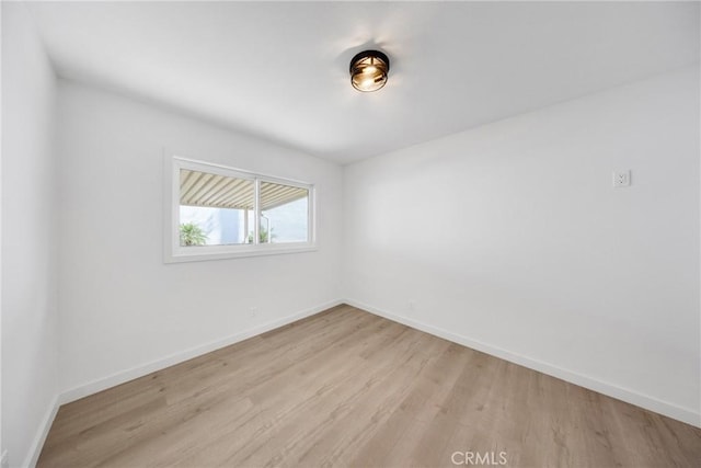 4832 Olive St, Montclair, CA 91763 - unfurnished room with light wood-style floors and baseboards
