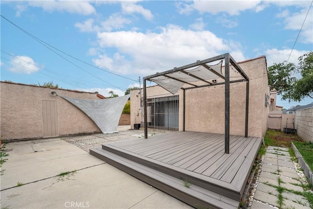 3712 Virginia Rd, Los Angeles, CA 90016 - back of property featuring a fenced backyard, stucco siding, and a deck
