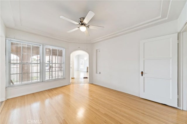 3712 Virginia Rd, Los Angeles, CA 90016 - unfurnished room featuring light wood-style floors, arched walkways, baseboards, and ceiling fan