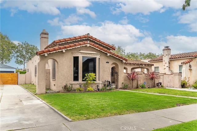 3712 Virginia Rd, Los Angeles, CA 90016 - mediterranean / spanish house featuring a gate, a chimney, and stucco siding