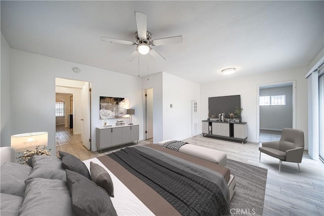 3712 Virginia Rd, Los Angeles, CA 90016 - bedroom with light wood-style floors, a ceiling fan, and multiple windows