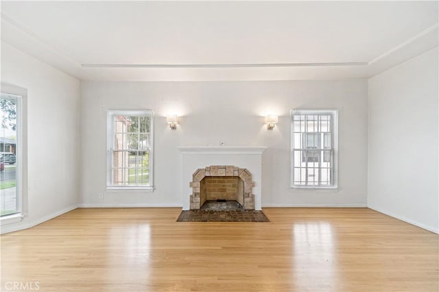 3712 Virginia Rd, Los Angeles, CA 90016 - unfurnished living room featuring light wood-type flooring, a fireplace with flush hearth, and baseboards