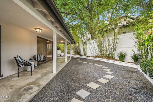 view of yard with a fenced backyard and a patio