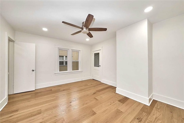 empty room featuring baseboards, light wood-type flooring, a ceiling fan, and recessed lighting