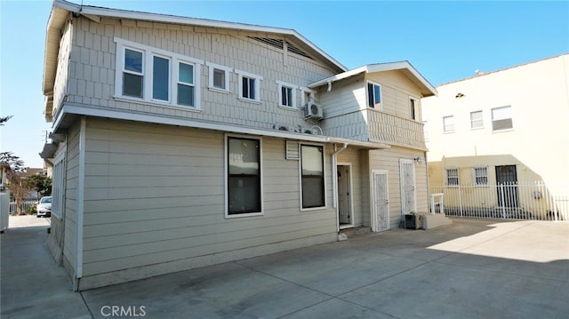 back of house with fence and a patio area