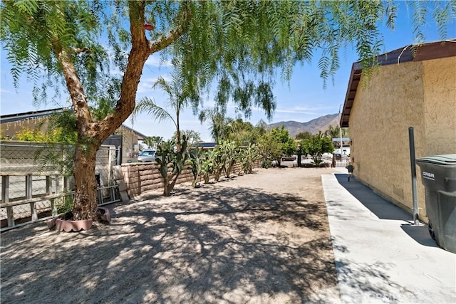 exterior space featuring driveway and a mountain view