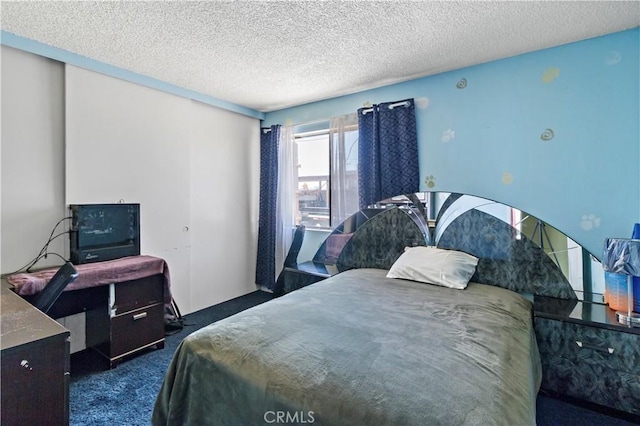 carpeted bedroom with a closet and a textured ceiling