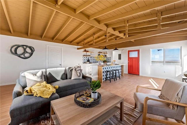 living area with light wood-style floors, wood ceiling, vaulted ceiling with beams, and baseboards