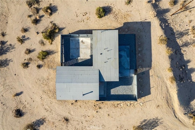 drone / aerial view with view of desert