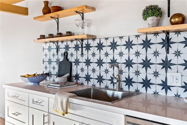 interior space with a sink and dishwashing machine
