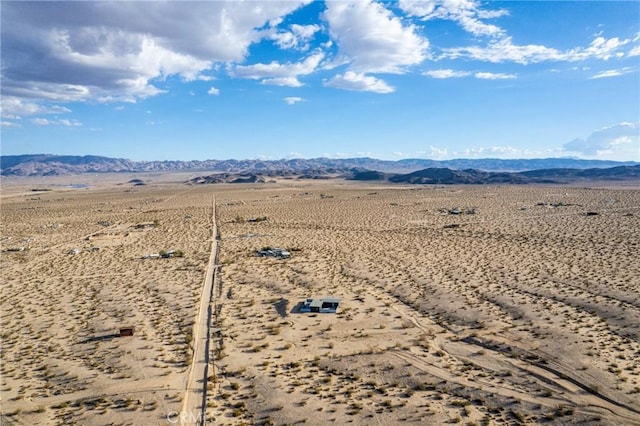 view of mountain feature featuring a rural view and view of desert
