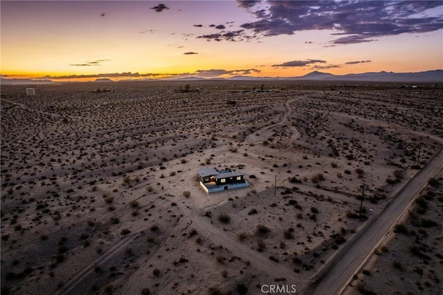 aerial view with a desert view, a mountain view, and a rural view