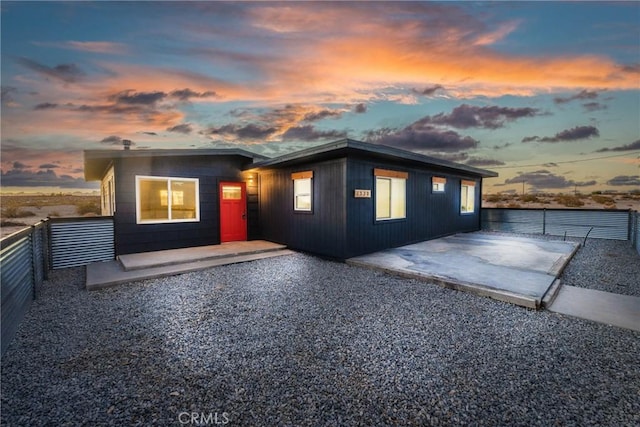 exterior space with a fenced backyard and a patio area