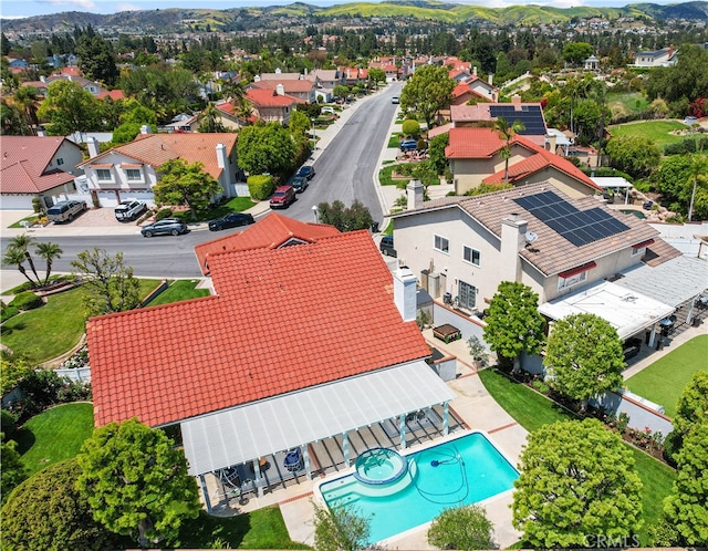 birds eye view of property with a residential view