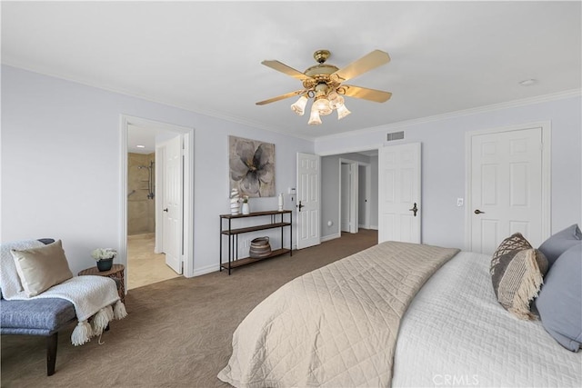 carpeted bedroom featuring visible vents, ornamental molding, baseboards, ceiling fan, and ensuite bath