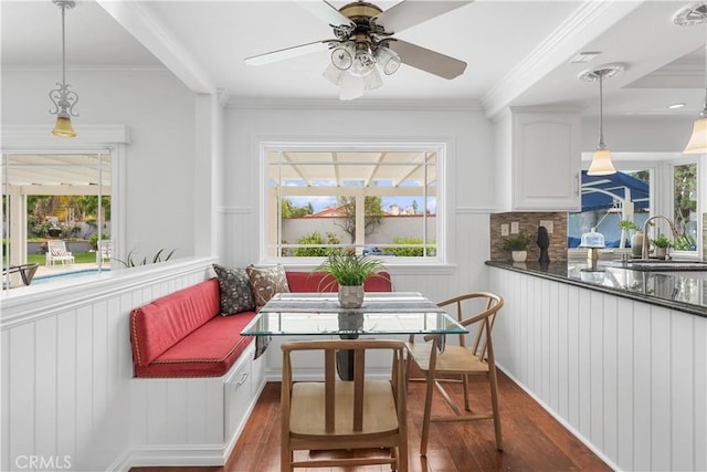 interior space featuring a ceiling fan, visible vents, and a sink