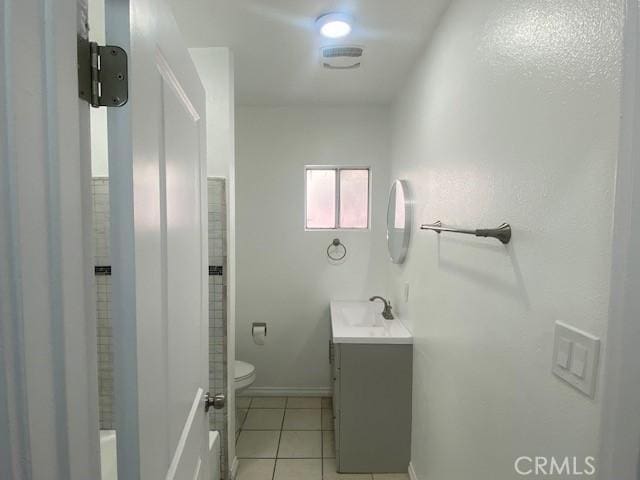 bathroom with visible vents, tile patterned floors, baseboards, vanity, and toilet