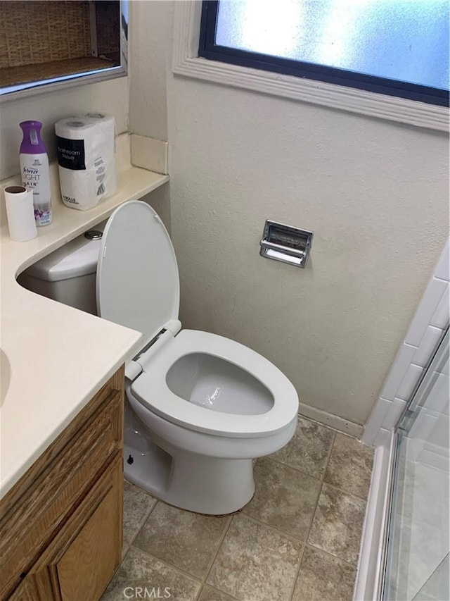 full bath featuring an enclosed shower, toilet, and vanity
