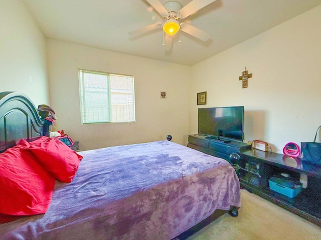 bedroom featuring a ceiling fan and carpet