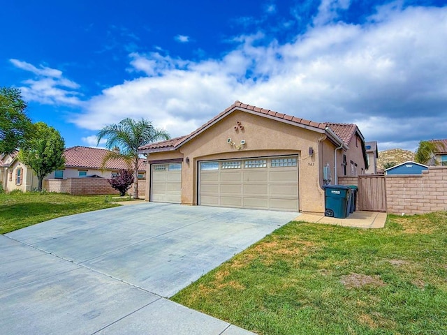 mediterranean / spanish home featuring a front lawn, fence, a tiled roof, an attached garage, and driveway