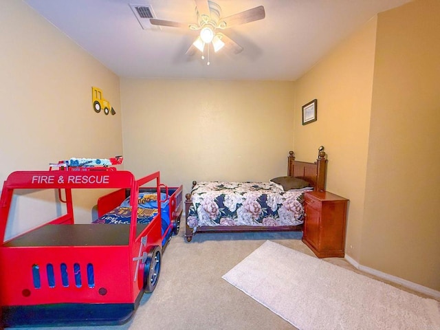 bedroom with visible vents, a ceiling fan, and carpet