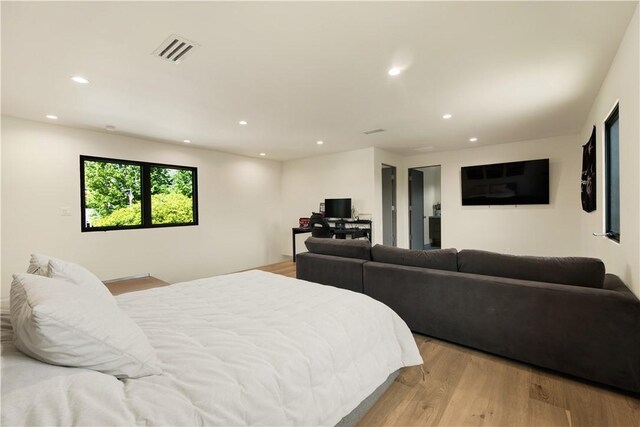 bedroom with recessed lighting, visible vents, and light wood finished floors