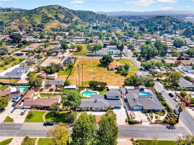 drone / aerial view featuring a residential view and a mountain view