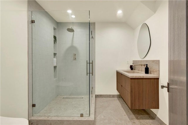 bathroom featuring vanity, baseboards, a shower stall, and recessed lighting