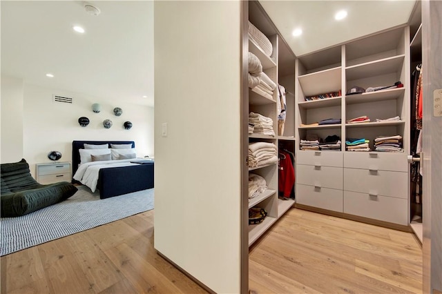 walk in closet featuring visible vents and wood finished floors