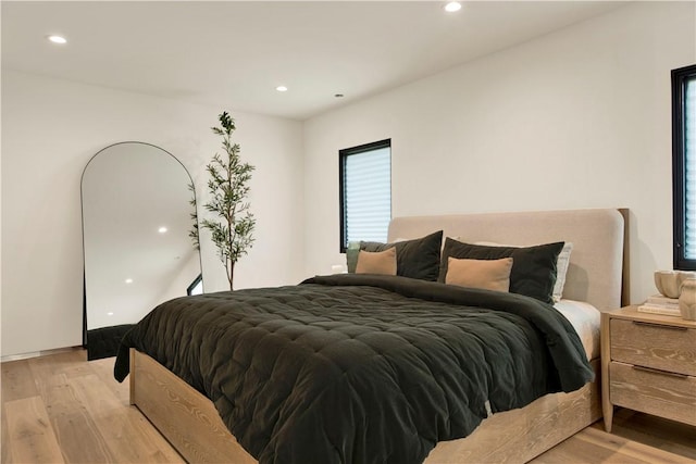 bedroom featuring recessed lighting and light wood finished floors