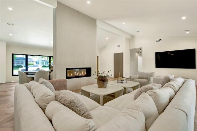 living area with high vaulted ceiling, a fireplace, recessed lighting, and visible vents