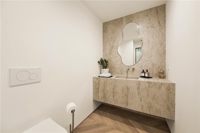bathroom featuring vanity and tile walls
