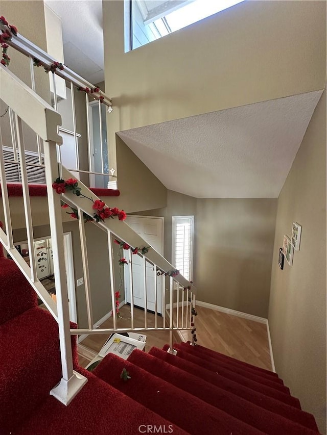 21205 Serra Unit 42, Lake Forest, CA 92630 - stairway with baseboards and wood finished floors