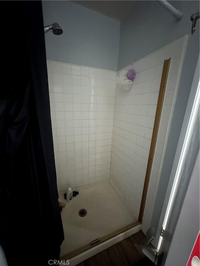 21205 Serra Unit 42, Lake Forest, CA 92630 - bathroom featuring wood finished floors and a stall shower