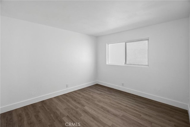 207 28th St, Newport Beach, CA 92663 - unfurnished room with baseboards and dark wood-style floors