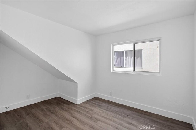 207 28th St, Newport Beach, CA 92663 - empty room featuring baseboards and dark wood-type flooring