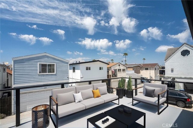 207 28th St, Newport Beach, CA 92663 - view of patio / terrace with outdoor lounge area, a residential view, a garage, and a balcony