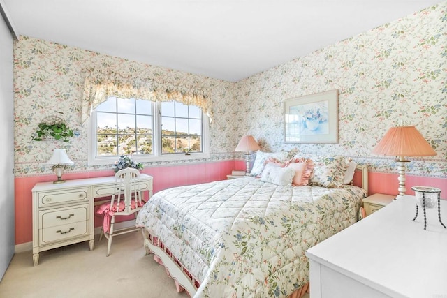 bedroom featuring light carpet and wallpapered walls
