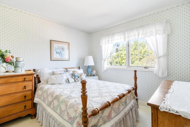 bedroom with light carpet and wallpapered walls