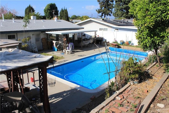 view of pool with a patio, fence, and a fenced in pool